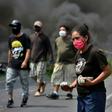 People take part in a protest against the burial of COVID-19 victims near their communities on the Tegucigalpa-Olancho highway