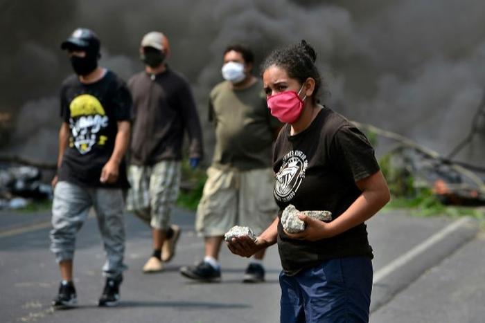 People take part in a protest against the burial of COVID-19 victims near their communities on the Tegucigalpa-Olancho highway