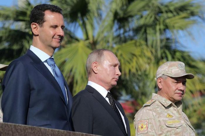 Syrian President Bashar al-Assad's (L, pictured December 2017 with Russian President Vladimir Putin, C) regime, supported by Moscow, in December 2019 relaunched its offensive against the northwestern region
