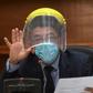 Judge Miguel Angel Galvez wears a face shield and a mask during a hearing against Guatemalan ex-president Otto Perez in Guatemala City on May 12, 2020