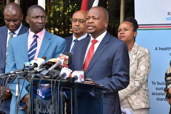 Health CS Mutahi Kagwe flanked by other government officials at a recent Covid-19 press conference