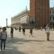 People walk around St Mark's Square in Venice, Italy, with some taking pictures of the famous sites as the country reopens to tourists from Europe after a months-long coronavirus lockdown