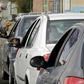 Members of the Iranian Red Crescent test people for coronavirus symptoms stopped on the Tehran to Alborz highway under a government order to screen every person for the illness