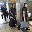 Federal police officers, pictured here carrying seized evidence, raided the residence of the governor of Rio de Janeiro, Wilson Witzel, as part of an anti-corruption investigation