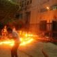 Lebanese protesters throw Molotov cocktails the branch of the central bank in the southern city of Sidon