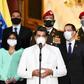 Since 2017, the government of President Nicolas Maduro (C, pictured March 2020) has announced its oil prices in yuan rather than dollars in protest over US sanctions