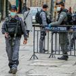 Israeli security forces, wearing protective masks as a precaution during the COVID-19 coronavirus pandemic, stand guard in Jerusalem's old city