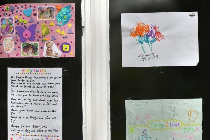 Messages of support for the residents are displayed in the windows of a care home in Stockport, Greater Manchester