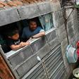 The economic devastation unleashed by the coronavirus has put intense pressure on Thailand's poor, like motorcycle rickshaw driver Thanapat Noidee (R)