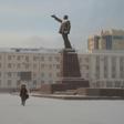 Locals walk through a square in the Siberian city of Yakutsk, where a court ruled to commit a shaman critical of Vladimir Putin to a mental asylum