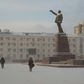 Locals walk through a square in the Siberian city of Yakutsk, where a court ruled to commit a shaman critical of Vladimir Putin to a mental asylum