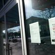 A "closed" sign is viewed on the door of the Tenley/Friendship DC Public Library on March 16, 2020, in Washington, DC