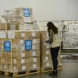 A staff member checks boxes of personal protective equipment aimed at helping the World Health Organization fight the coronavirus, at Ethiopia Airlines' cargo facility at the Bole International Airport in Addis Ababa