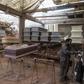 A worker prepares to paint a coffin at a factory in Lima's  Juan de Lurigancho district