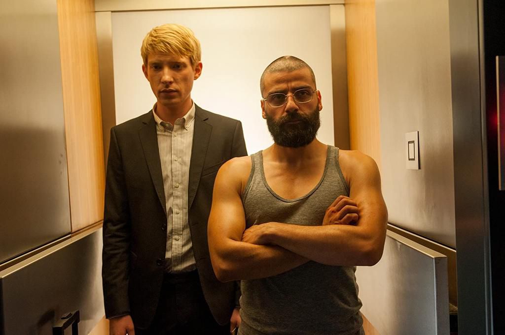 Gleeson and Oscar Isaac in Ex Machina. The pair also appear together in the Star Wars films.