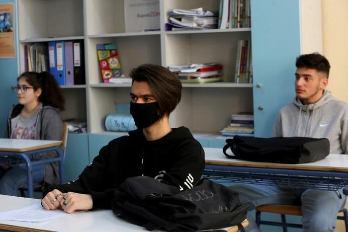 Some students in Athens wore masks in class. Greece reopened high schools for final-year pupils, with a reduced number of students per classroom