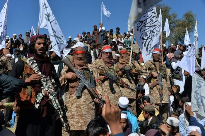 Afghan Taliban militants and villagers attend a gathering as they celebrate the peace deal and their victory in the Afghan conflict on US in Afghanistan, in Alingar district of Laghman Province on March 2, 2020
