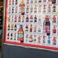 Two men leave a so-called "bottle shop" in Melbourne after major alcohol retailers in Australia agreed to enforce new rules limiting individual purchases