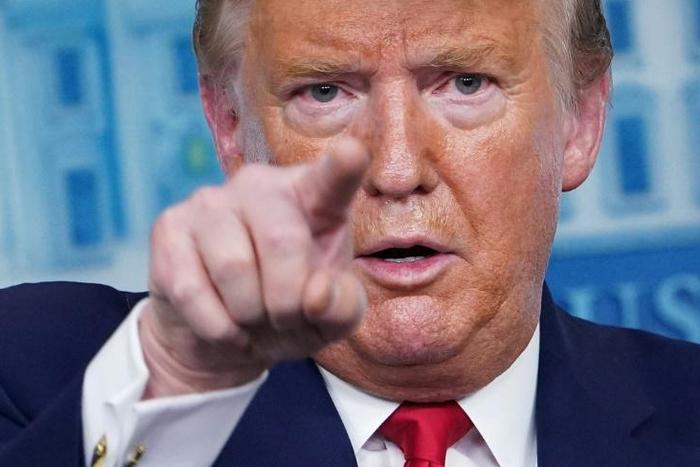 US President Donald Trump, pictured here at a press briefing, is warning Iran against attacks on US troops in Iraq