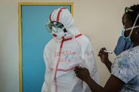 File image of a doctor gearing up to enter the KNH isolation ward
