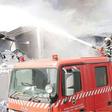 Firefighters at Metro Plastics Kenya Ltd in Industrial Area, Nairobi on March 14, 2020. Police are investigating claims that employees at the factory were allegedly locked up overnight by the employer
