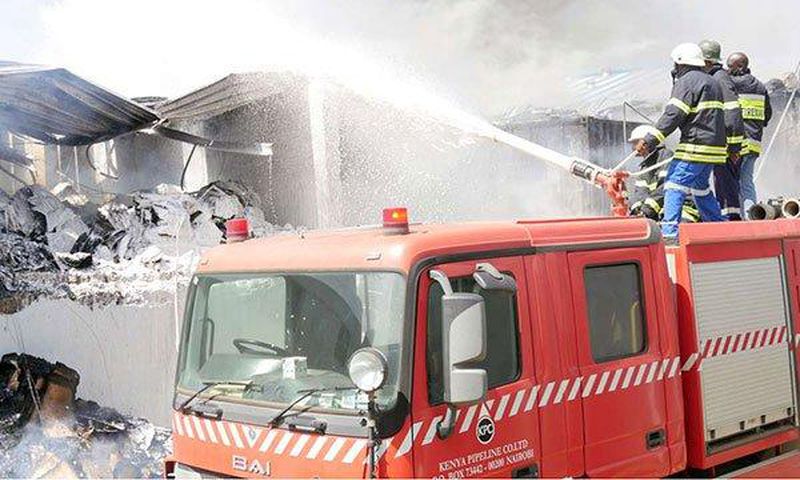 Firefighters at Metro Plastics Kenya Ltd in Industrial Area, Nairobi on March 14, 2020. Police are investigating claims that employees at the factory were allegedly locked up overnight by the employer