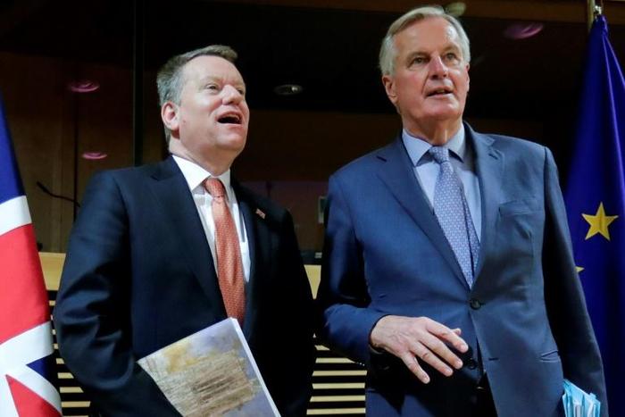 Britain's chief post-Brexit negotiator with the EU David Frost (left) is self isolating after showing "mild" coronavirus symptoms. His EU counterpart Michel Barnier (right) tested positive earlier this week