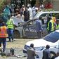 Sudanese rescue teams and security forces circle damaged vehicles at the site of a bomb attack targeting the convoy of Prime Minister Abdalla Hamdok, who survived the attack unharmed