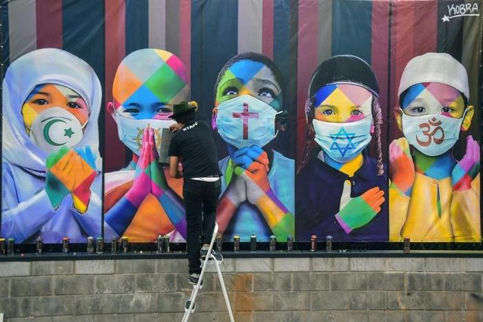 Brazilian muralist Kobra's most recent work "Coexistence" represents five children from five of the world's major religions