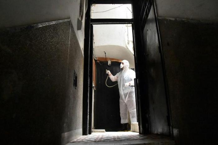 A man disinfects a building in Algiers on March 20