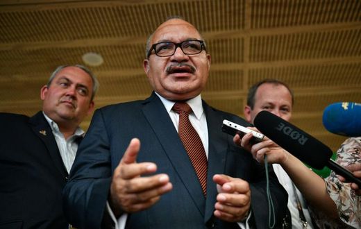 Papua New Guinea's former prime minister Peter O'Neill (C), pictured here in November 2018, has been arrested