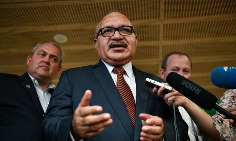 Papua New Guinea's former prime minister Peter O'Neill (C), pictured here in November 2018, has been arrested