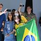 Brazilian President Jair Bolsonaro and his daughter Laura (C) pose for a selfie with supporters outside his residence in Brasilia on Sunday