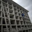 A worker builds vertical graves during the COVID-19 coronavirus pandemic at the Caju Cemetery in Rio de Janeiro, Brazil