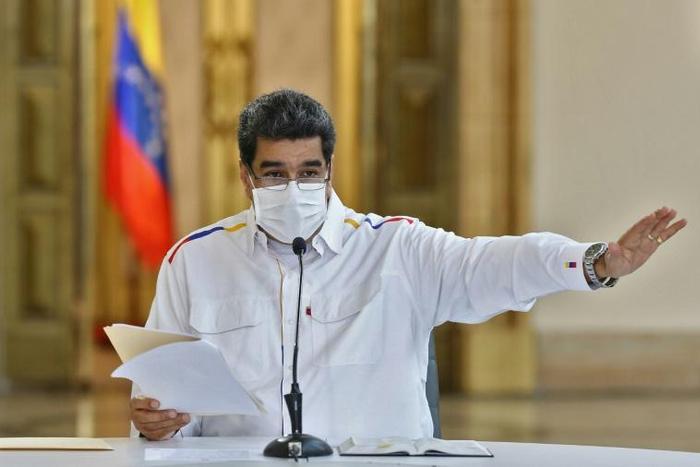 Venezuelan President Nicolas Maduro reads a televised message on May 9, 2020