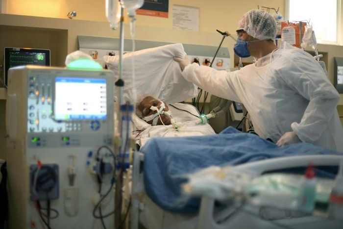 A nurse assists a COVID-19 patient at the Oceanico de Niteroi in Rio de Janeiro June 22, 2020