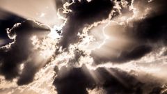 Light of the setting sun through the clouds