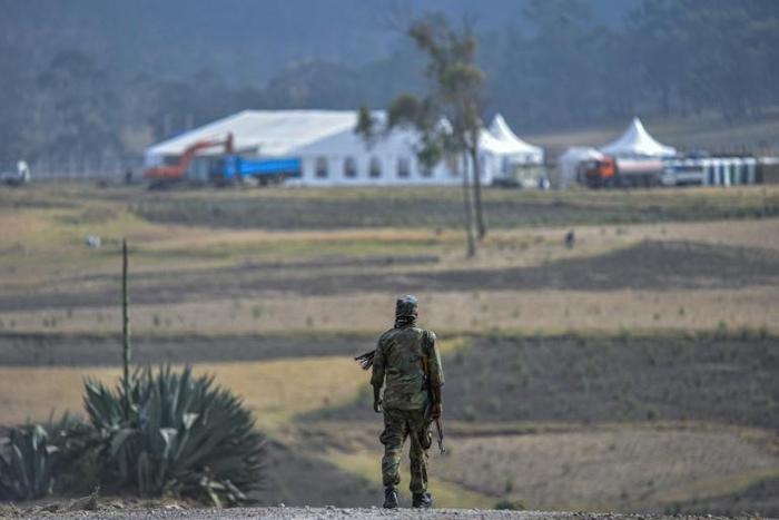 Security forces blocked journalists from attending the ceremony at the crash site, though vehicles transporting families could be seen heading there
