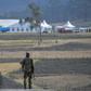 Security forces blocked journalists from attending the ceremony at the crash site, though vehicles transporting families could be seen heading there
