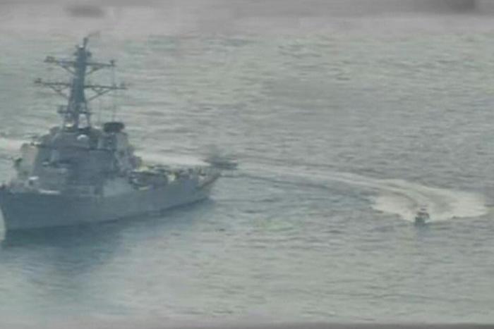 This US Navy file photo shows Iranian Islamic Revolutionary Guard Corps Navy (IRGCN) vessels speeding around the guided-missile destroyer USS Paul Hamilton (DDG 60) in the northern Gulf on April 15, 2020