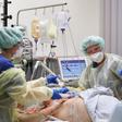 Medical staff take care of a Covid-19 patient in the intensive care unit at the community hospital in Magdeburg, eastern Germany