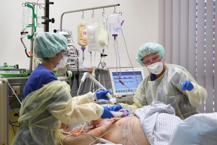 Medical staff take care of a Covid-19 patient in the intensive care unit at the community hospital in Magdeburg, eastern Germany