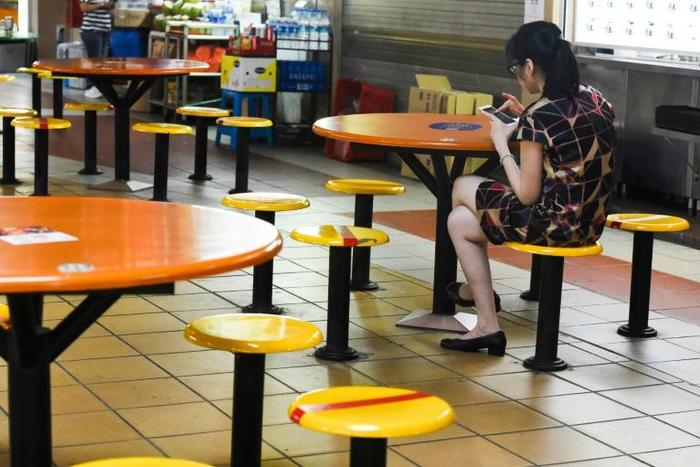 The city-state has introduced a series of new measures to tackle the virus, including closing bars and cinemas as well as banning large events