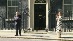 British Prime minister Boris Johnson and 'Clap for Carers' founder Annemarie Plas clap for the NHS outside 10 Downing street