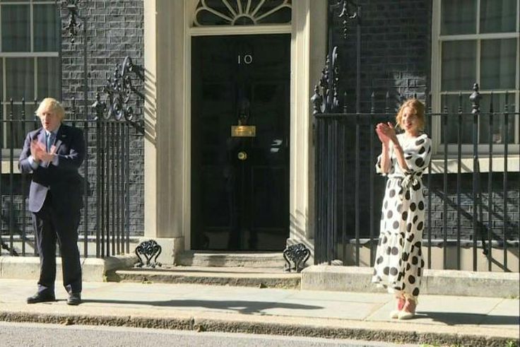 British Prime minister Boris Johnson and 'Clap for Carers' founder Annemarie Plas clap for the NHS outside 10 Downing street