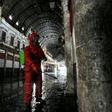 A Red Crescent member sprays disinfectant along an alley of the historic Hamidiya souk (market) in the old city of Syria's capital Damascus as part of efforts against the coronavirus pandemic