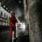 A Red Crescent member sprays disinfectant along an alley of the historic Hamidiya souk (market) in the old city of Syria's capital Damascus as part of efforts against the coronavirus pandemic
