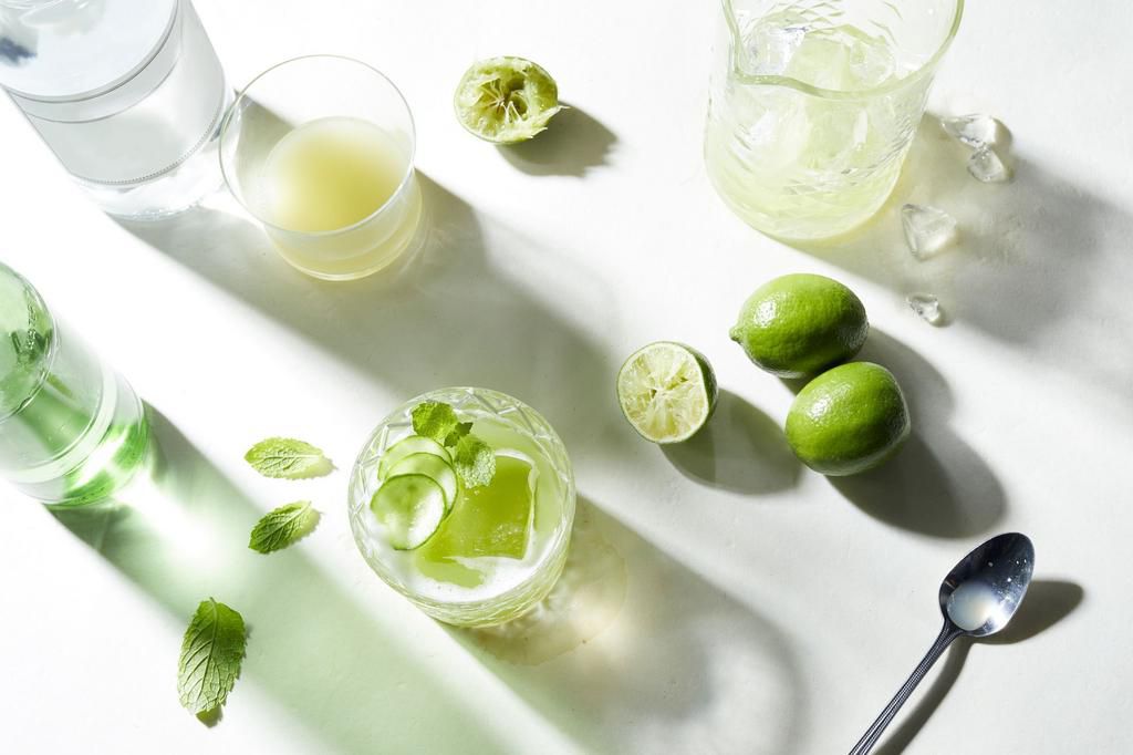 Lime and soda cocktail preparation, overhead view