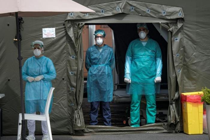 Medical staff at Mohammmed V military hospital wear  protective masks and caps as they wait for patients in the Moroccan capital Rabat