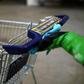 Katharina Obladen and Tanja Nickel have seen demand for their virus-killer products skyrocket -- here a student cleans a shopping trolley for disinfection at their workshop in Cologne